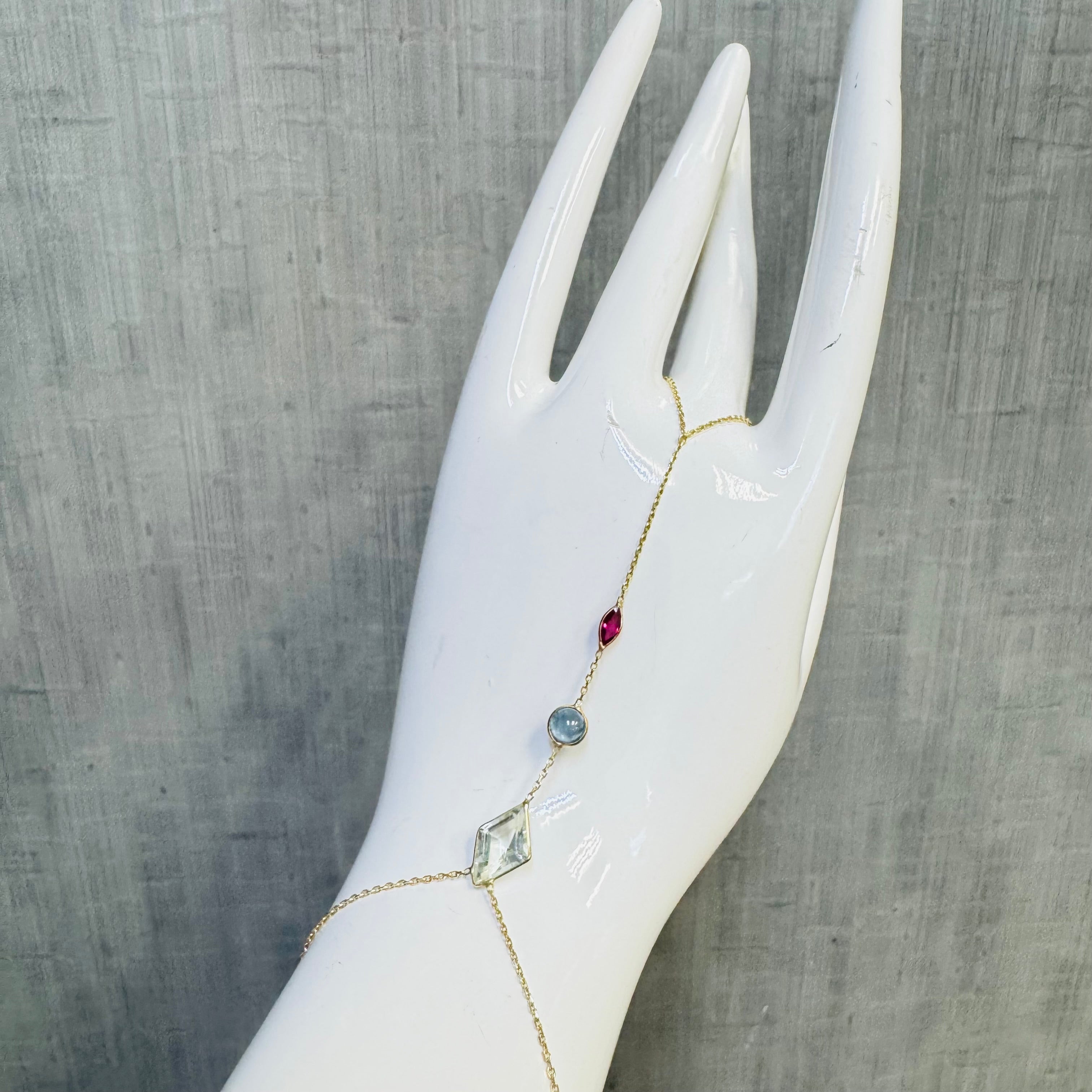 Aquamarine Sapphire and Ruby Handchain in solid 14k Yellow Gold