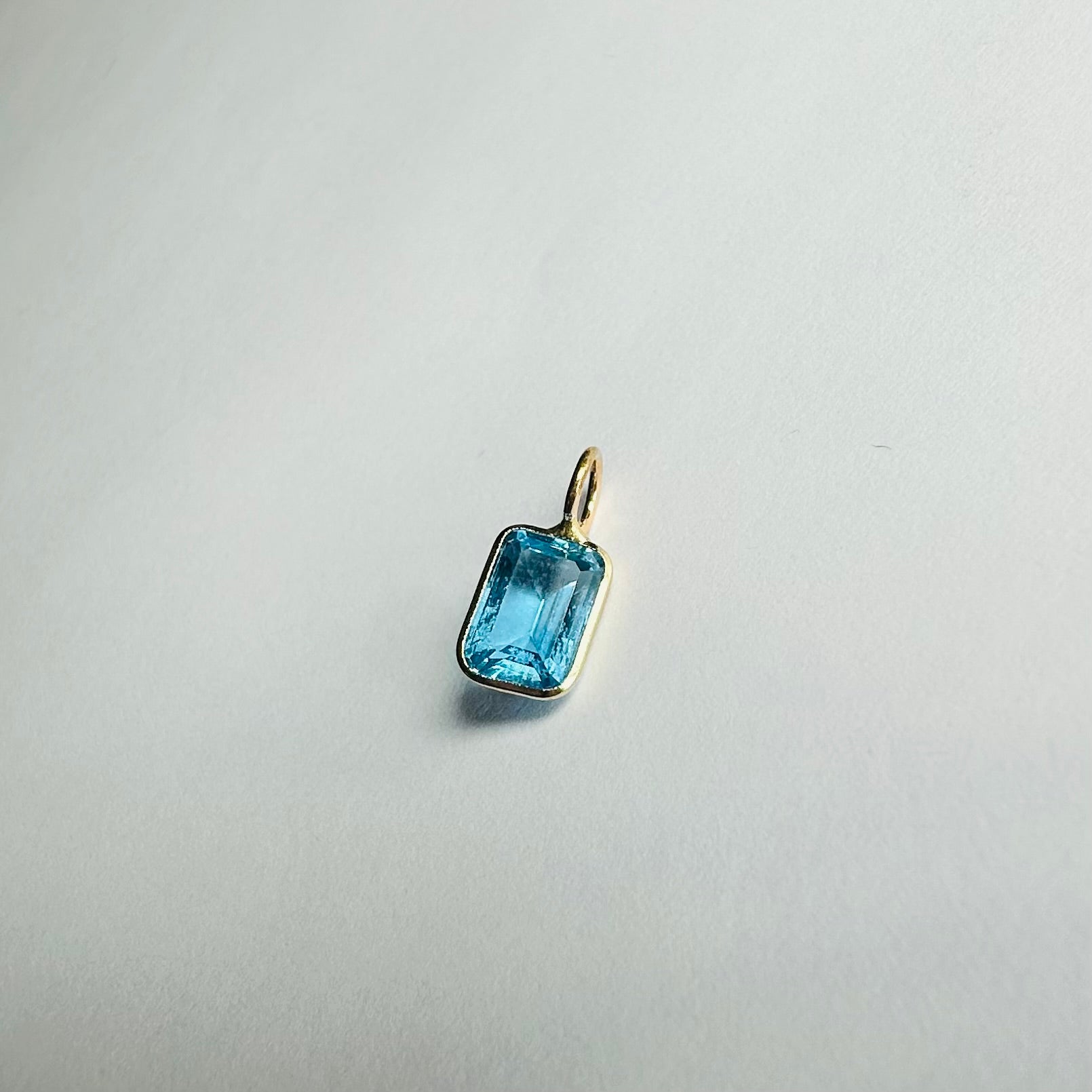 14K Blue Topaz Yellow Gold Emerald Cut Charm