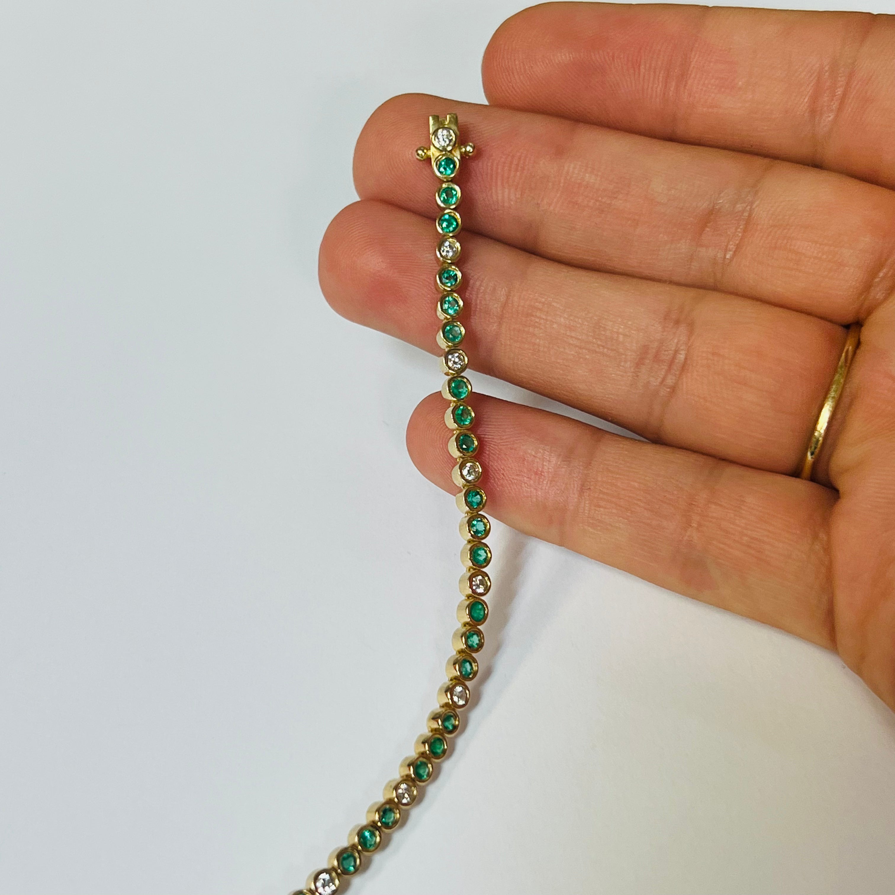 Stunning 14K Yellow Gold Emerald and Diamond Bezel Set Tennis Bracelet, 6.75"