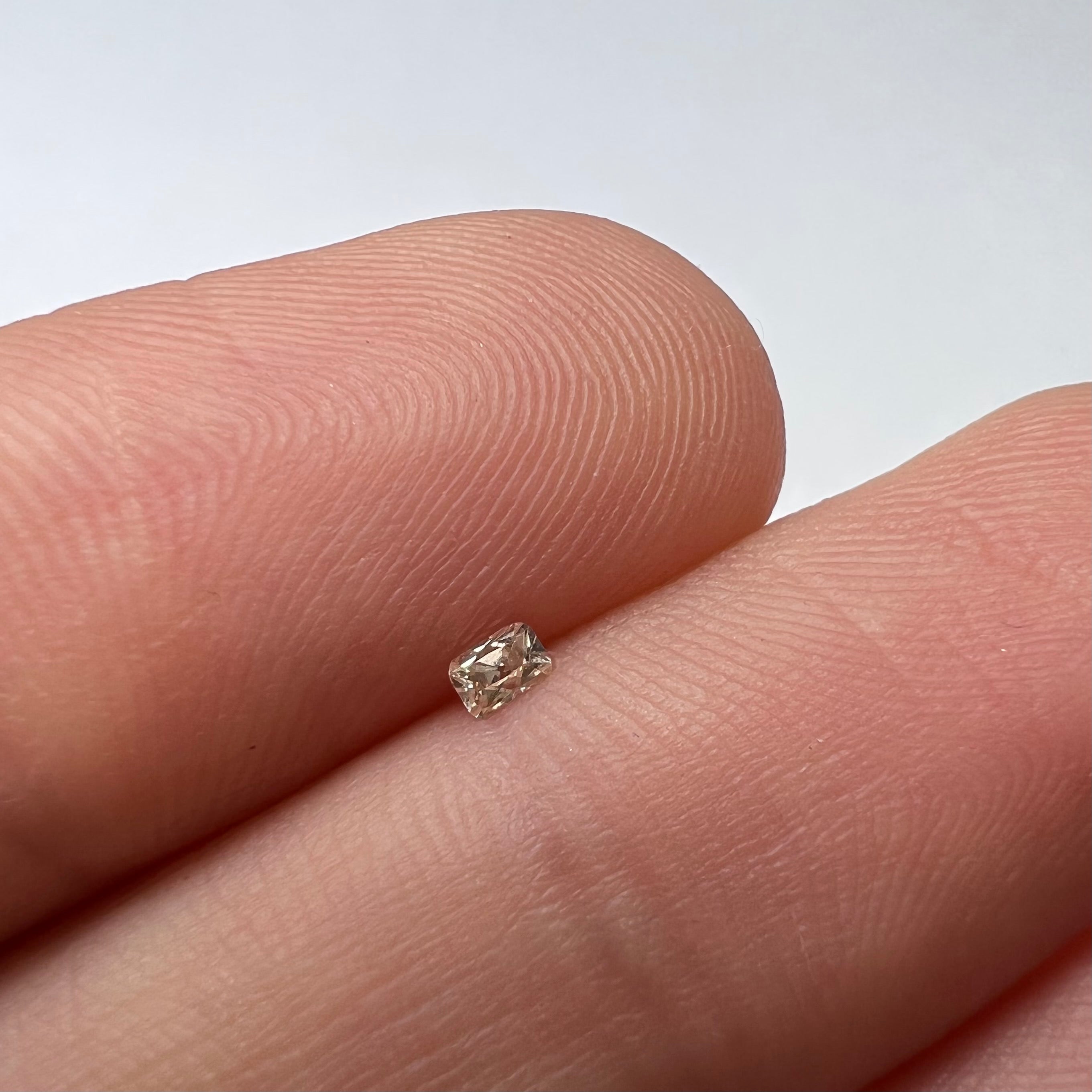 .065CT Emerald Cut Light Champagne SI1 2.66x1.82x1.67mm Natural Earth mined