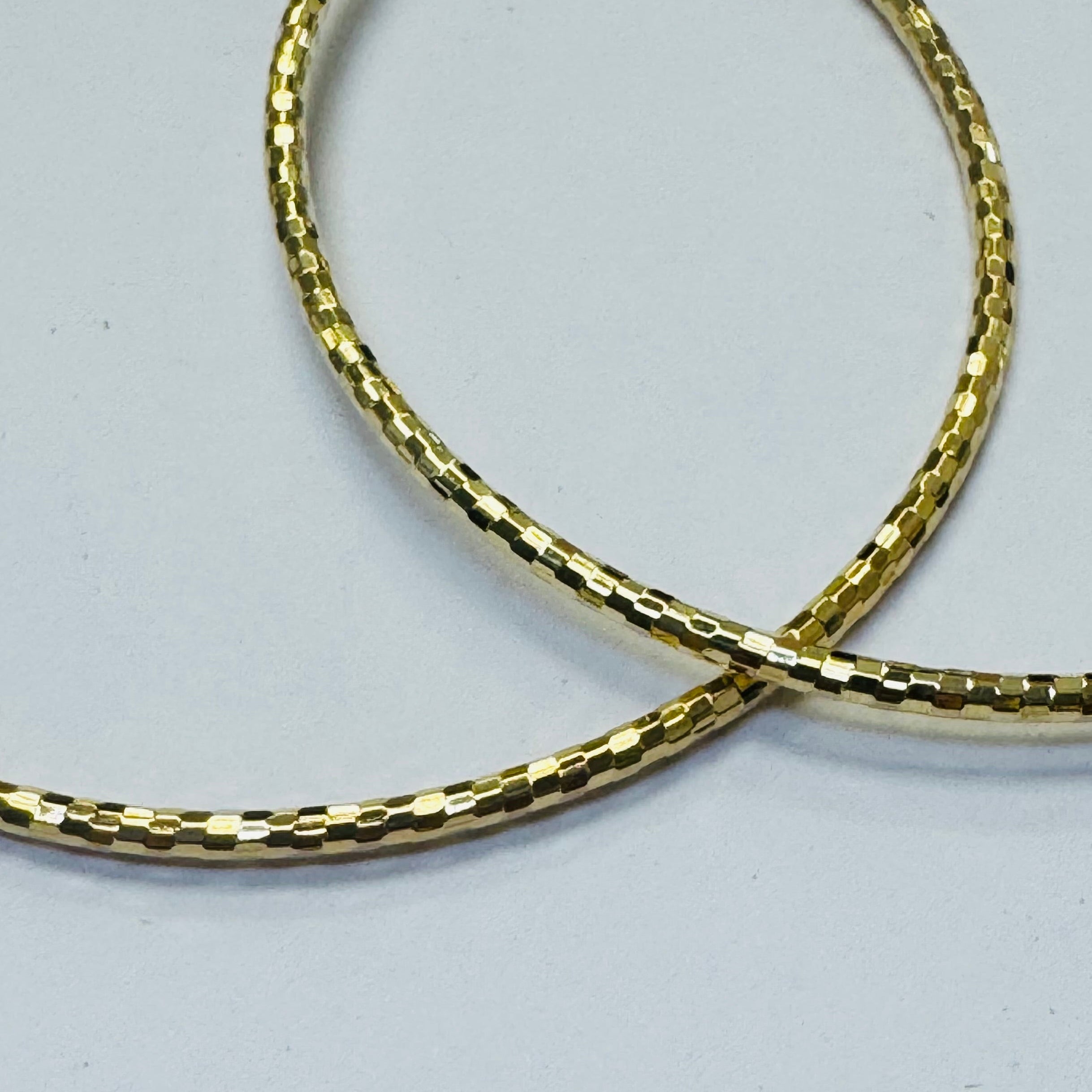 2.5” Shimmering 10K Yellow Gold Hoop Earrings