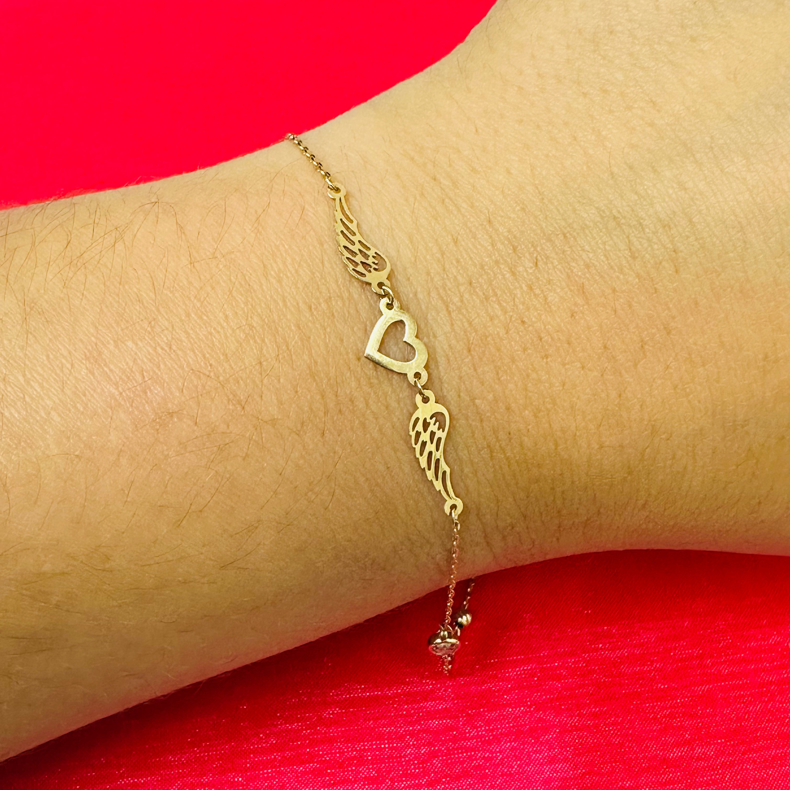 14K 7-8" Yellow Gold Heart With Wings Bracelet