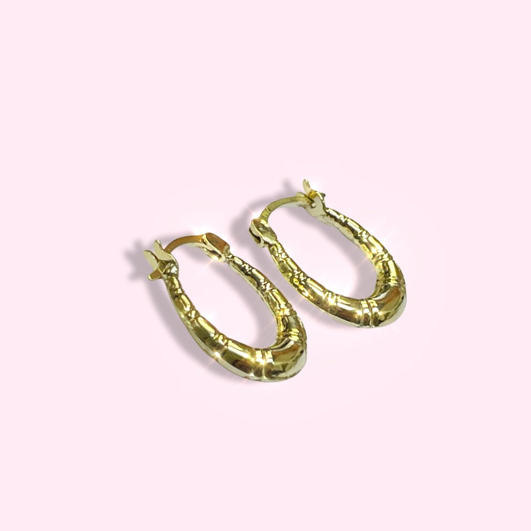 .65” 10K Yellow Gold Tapered Puffed Striped Oval Hoop Earrings