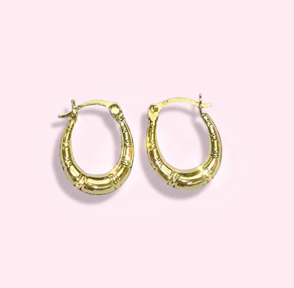 .65” 10K Yellow Gold Tapered Puffed Striped Oval Hoop Earrings